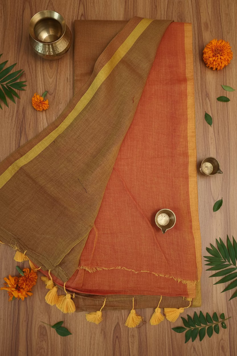 Half Brown and half orange saree with yellow tassels in the pallu